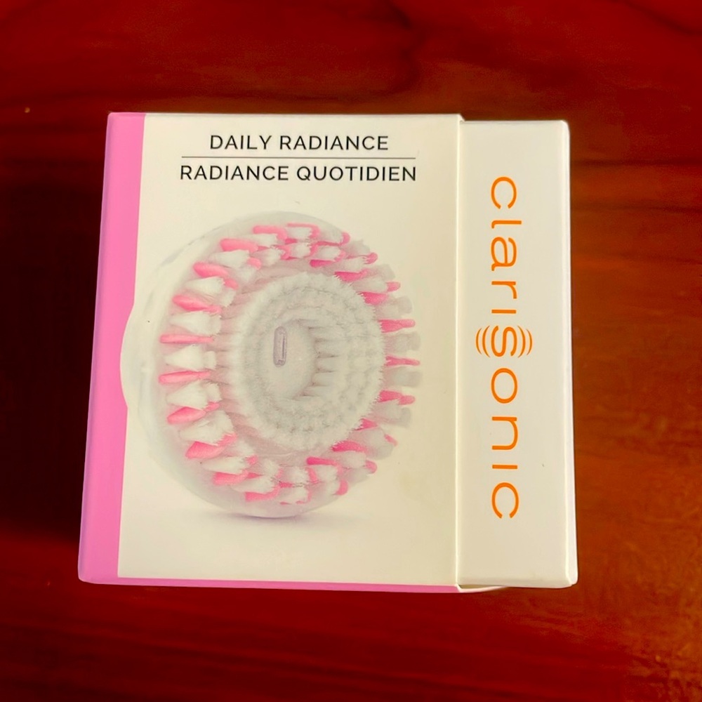 Daily radiance, head brush, brand new , still sealed, never been opened.